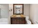 Bathroom featuring double sinks, granite countertop, and dark wood cabinets at 3338 Peachtree Ne Rd # 508, Atlanta, GA 30326