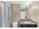 Full bathroom featuring a granite vanity top, sleek fixtures, and shower with curtain at 3338 Peachtree Ne Rd # 508, Atlanta, GA 30326