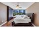 Bedroom with large windows offering city views and dark wood floors at 3338 Peachtree Ne Rd # 508, Atlanta, GA 30326