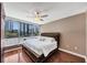 Bedroom with city views, ceiling fan, and hardwood floors at 3338 Peachtree Ne Rd # 508, Atlanta, GA 30326