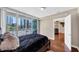 Bedroom with balcony, wood floors, city view, and access to ensuite bathroom at 3338 Peachtree Ne Rd # 508, Atlanta, GA 30326