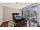 Bedroom with a view from the balcony offering glimpses of the city skyline at 3338 Peachtree Ne Rd # 508, Atlanta, GA 30326