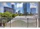 Downtown skyline views from the balcony showcasing modern architecture and lush greenery at 3338 Peachtree Ne Rd # 508, Atlanta, GA 30326