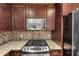 Beautiful kitchen with granite countertops and stainless steel microwave at 3338 Peachtree Ne Rd # 508, Atlanta, GA 30326