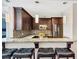 Well-appointed kitchen with bar seating, stainless steel appliances, and granite countertops at 3338 Peachtree Ne Rd # 508, Atlanta, GA 30326