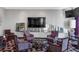 Modern lounge area with patterned chairs, a unique coffee table, and a large-screen television at 3338 Peachtree Ne Rd # 508, Atlanta, GA 30326
