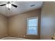 Bedroom with a ceiling fan, a window with blinds, neutral paint, and carpet at 3878 Hannahberry Pl, Buford, GA 30519