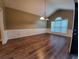 Bright dining room featuring new wood flooring, modern trim, and a window at 3878 Hannahberry Pl, Buford, GA 30519
