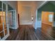 Spacious entryway featuring new wood flooring and stylish millwork at 3878 Hannahberry Pl, Buford, GA 30519