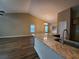 Open-concept living space featuring modern floors, many windows, and updated lighting at 3878 Hannahberry Pl, Buford, GA 30519
