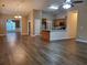 Open-concept living space featuring modern floors, updated lighting, and dining area at 3878 Hannahberry Pl, Buford, GA 30519