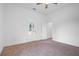 A bright carpeted bedroom with a door to the outside at 1993 Reynolds Sw Dr, Atlanta, GA 30315