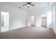 Bedroom with ceiling fan, carpet, and multiple doorways at 1993 Reynolds Sw Dr, Atlanta, GA 30315