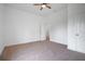A bright carpeted bedroom with a ceiling fan and white trim at 1993 Reynolds Sw Dr, Atlanta, GA 30315