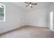 Spacious bedroom featuring neutral carpet, ceiling fan, and white walls at 1993 Reynolds Sw Dr, Atlanta, GA 30315