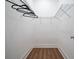 Walk-in closet with wood floor and installed metal shelving for organized storage at 1993 Reynolds Sw Dr, Atlanta, GA 30315