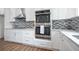Well-equipped kitchen with stainless steel appliances and ample white cabinet storage at 1993 Reynolds Sw Dr, Atlanta, GA 30315