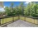 Relax on this wooden deck overlooking a lush yard with mature trees at 3156 Ozmer Lndg, Decatur, GA 30034