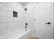 Clean bathroom with tiled walls, a tub, and a dark rainfall shower head at 3156 Ozmer Lndg, Decatur, GA 30034