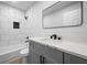 Modern bathroom with white subway tile, a gray vanity, and a sleek black faucet at 3156 Ozmer Lndg, Decatur, GA 30034