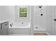 Modern bathroom featuring a soaking tub, a walk-in shower, and elegant fixtures for a spa-like experience at 3156 Ozmer Lndg, Decatur, GA 30034