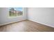 Cozy bedroom with a large window offering a view of the house next door at 3156 Ozmer Lndg, Decatur, GA 30034