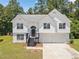 Charming two-story home with a well-maintained lawn, front-facing garage and classic curb appeal at 3156 Ozmer Lndg, Decatur, GA 30034