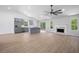 Open-concept floor plan with a modern kitchen, fireplace, and ample natural light, perfect for comfortable living at 3156 Ozmer Lndg, Decatur, GA 30034