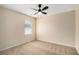 Bright bedroom features a ceiling fan and large window at 3634 Cape Ln, Conyers, GA 30013