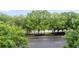 Scenic view from a balcony overlooking a tranquil lake surrounded by lush trees at 400 17Th Nw St # 1321, Atlanta, GA 30363