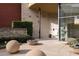 Building entrance featuring modern architecture, greenery, and spherical planters at 400 17Th Nw St # 1321, Atlanta, GA 30363