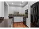 Modern kitchen featuring white cabinets, stainless steel appliances, and tile backsplash at 400 17Th Nw St # 1321, Atlanta, GA 30363
