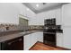 Well-lit kitchen features sleek white cabinets, dark countertops, and stainless steel appliances at 400 17Th Nw St # 1321, Atlanta, GA 30363