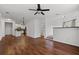 Open-concept living area with hardwood floors flowing into the kitchen at 400 17Th Nw St # 1321, Atlanta, GA 30363