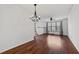 Spacious living room with hardwood floors, large windows, and modern lighting fixtures at 400 17Th Nw St # 1321, Atlanta, GA 30363