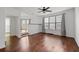 Bright living room features hardwood floors, a ceiling fan, and large windows at 400 17Th Nw St # 1321, Atlanta, GA 30363