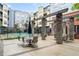Outdoor pool area surrounded by a decorative patio with seating and lounge areas at 400 17Th Nw St # 1321, Atlanta, GA 30363
