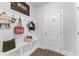 Mudroom features a built-in bench with storage and hooks, creating a functional space for organization at 510 Cunninghame Ct, Peachtree City, GA 30269