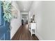 Welcoming foyer featuring hardwood floors, a stylish console table, and an open view into the living spaces at 510 Cunninghame Ct, Peachtree City, GA 30269
