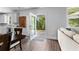 Open concept living room with dining area and view to the backyard at 510 Cunninghame Ct, Peachtree City, GA 30269