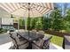 Relax on the patio with cushioned seating and an umbrella-covered dining table, perfect for backyard entertaining at 510 Cunninghame Ct, Peachtree City, GA 30269