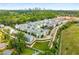 Aerial view of a vibrant community with modern townhomes, lush green spaces, and a skyline backdrop at 752 Winton Way, Atlanta, GA 30312