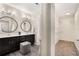 Elegant bathroom with double vanity, modern fixtures, and a conveniently located walk-in closet at 752 Winton Way, Atlanta, GA 30312