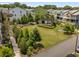 Wide aerial view showcasing the community green space, gathering areas, and colorful townhome exteriors at 752 Winton Way, Atlanta, GA 30312