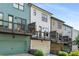 Colorful townhomes with balconies, attached garages and nicely manicured landscaping at 752 Winton Way, Atlanta, GA 30312
