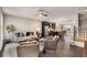 Inviting living room with hardwood floors, comfortable seating, and seamless open plan flowing to a modern kitchen space at 752 Winton Way, Atlanta, GA 30312