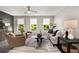 Well-lit living room with hardwood floors, plush seating, and neutral decor with large windows and plenty of natural light at 752 Winton Way, Atlanta, GA 30312