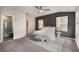 Main bedroom with a gray accent wall, carpet floors, and a modern en suite bathroom at 752 Winton Way, Atlanta, GA 30312