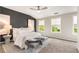 Spacious main bedroom featuring a gray accent wall, carpet floors, and ample natural light at 752 Winton Way, Atlanta, GA 30312