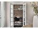 Cozy office features a brick accent wall, white shelves, and a modern black desk set at 752 Winton Way, Atlanta, GA 30312